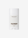 A white deodorant stick container from Shores Company, labeled 'Beachwood Natural Deodorant', centered on a light gray background.