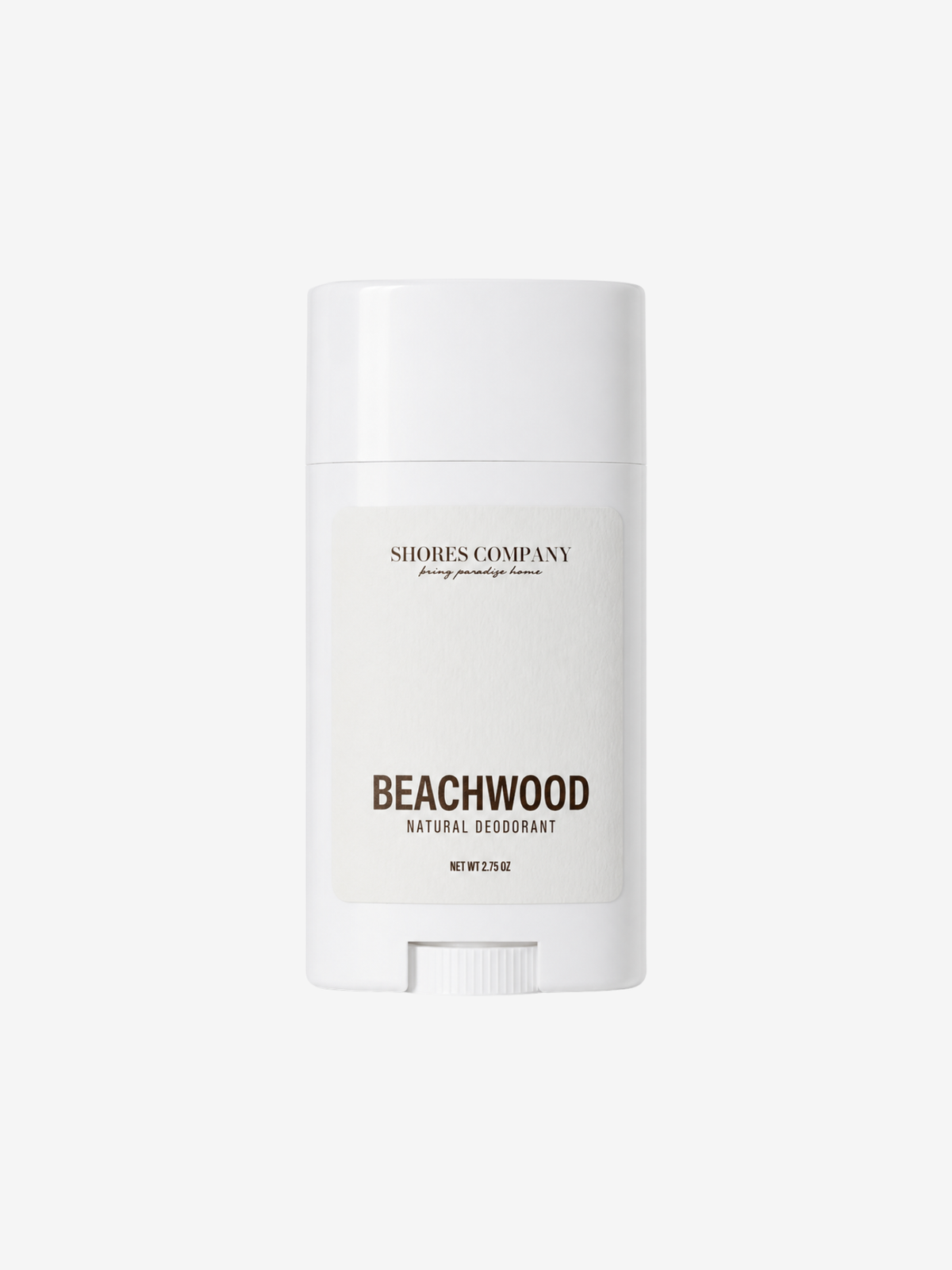A white deodorant stick container from Shores Company, labeled 'Beachwood Natural Deodorant', centered on a light gray background.