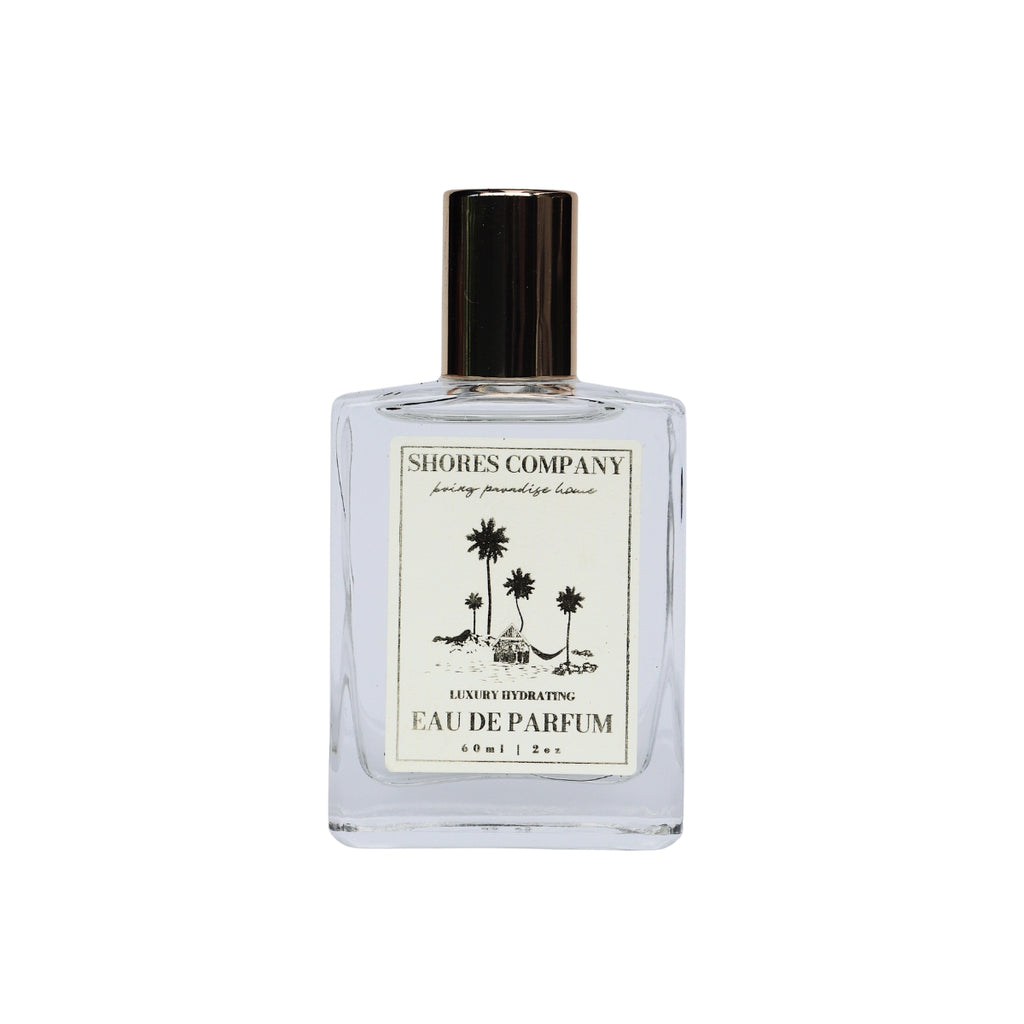Elegant bottle of Coffea Flores Eau de Parfum, featuring a tropical blend of acai, jasmine, and coconut milk. A refreshing, island-inspired fragrance perfect for daily wear, capturing the essence of sunlit mornings and vibrant island life.