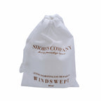 Elegant Windswept Eau de Parfum, infused with floral notes like gardenia and lily of the valley, offering a tranquil, island-inspired aroma ideal for everyday wear