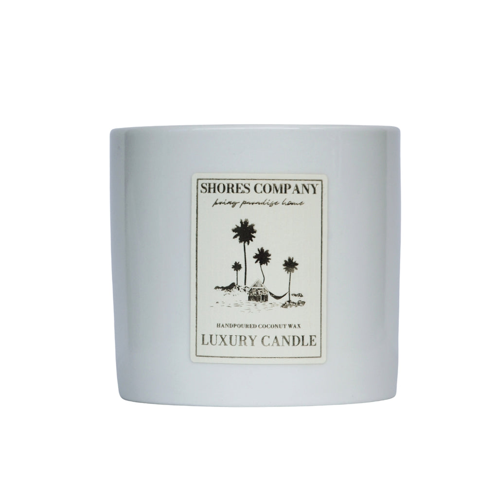 8oz hand-poured coconut wax candle in Island Bohemia scent, featuring vibrant notes of mandarin, orange, coconut, raspberry, strawberry, jasmine, and vanilla, housed in a stylish ceramic container for a fresh, tropical ambiance.