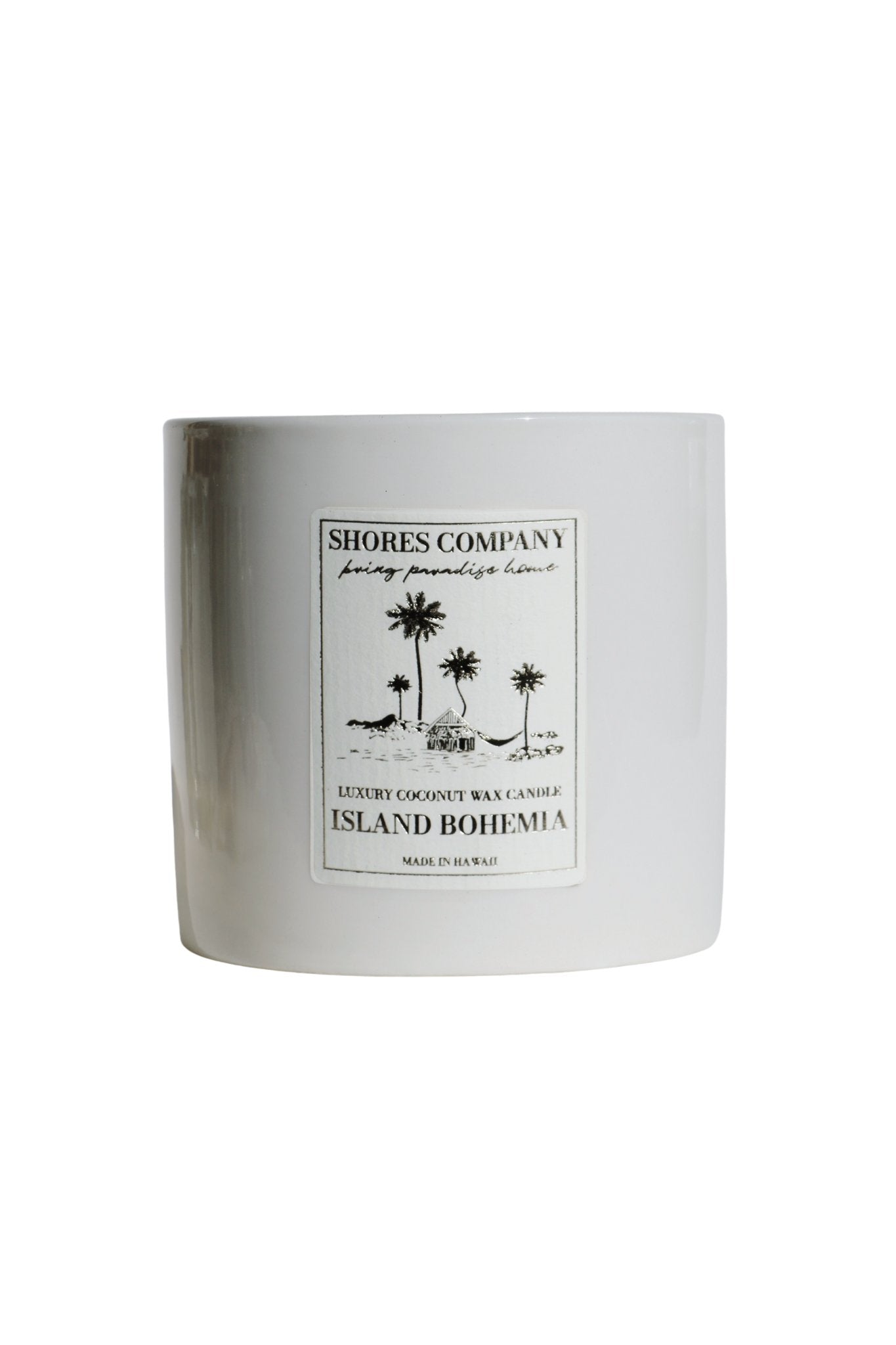 Candle with 'Shores Company' label on a white background
