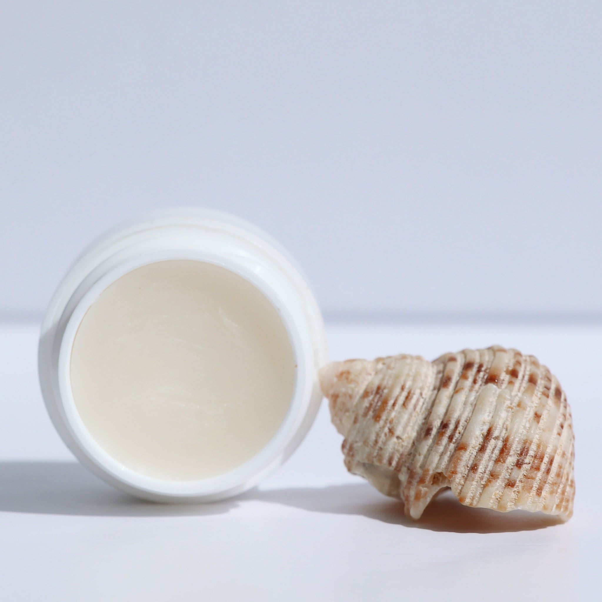 Hydrating Lip Nectar Balm – island-inspired lip balm with botanical oils for soft, non-sticky lip care.