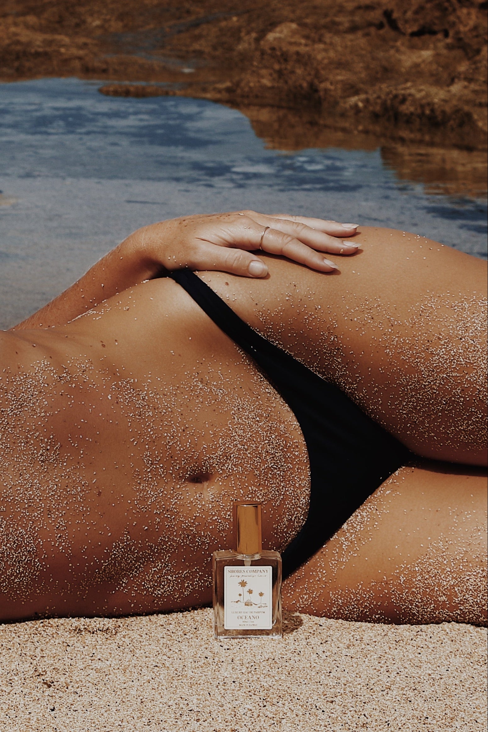 Ocean muse sunbathing with perfume