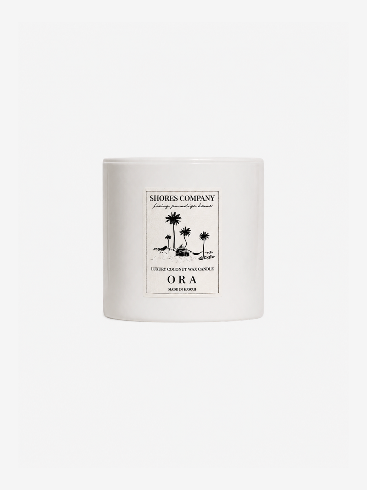 A white ceramic candle jar with a minimalist black graphic label reading 'Shores Company' and 'ORA', set against a solid white background.