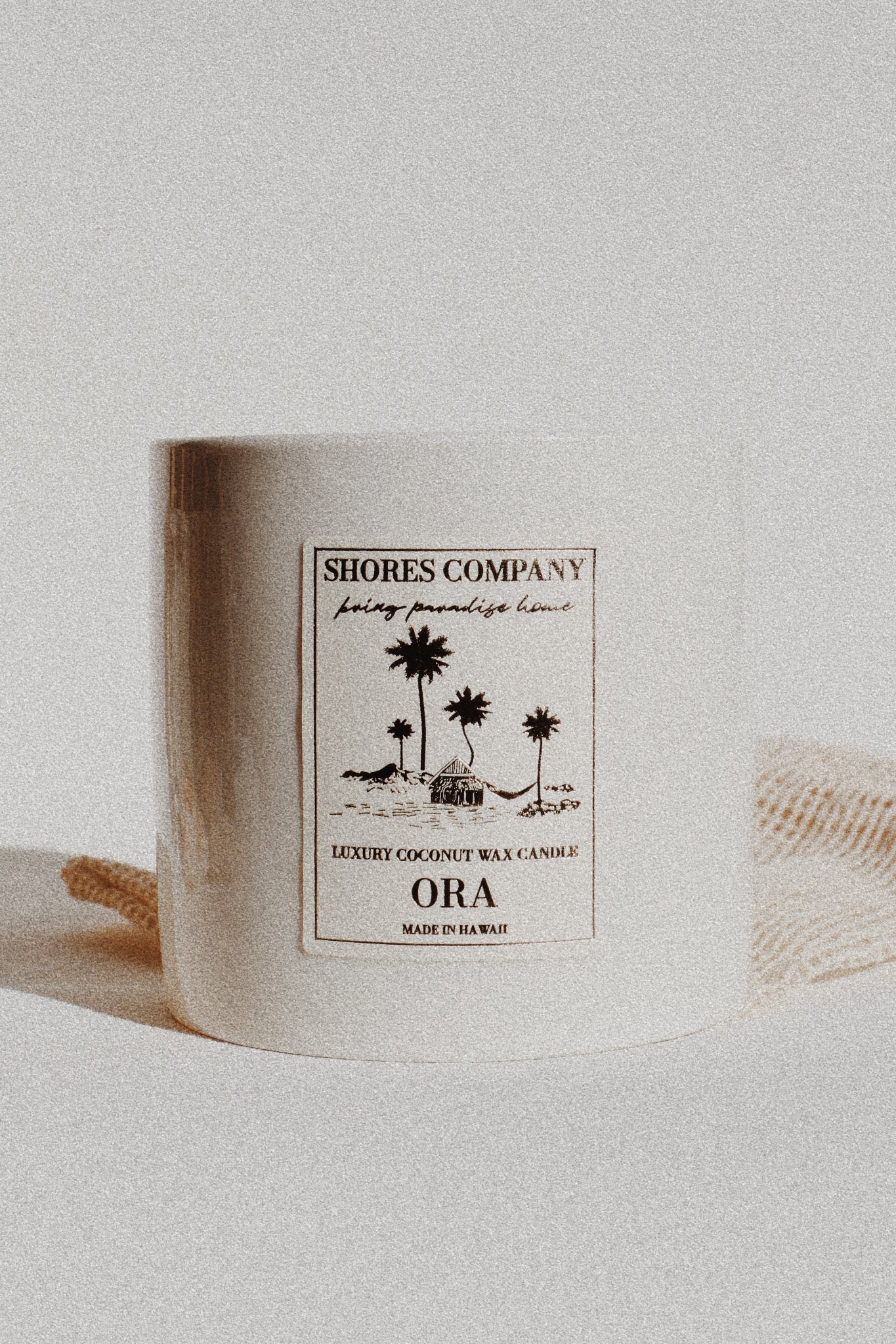 Ora Candle with a label on a light background