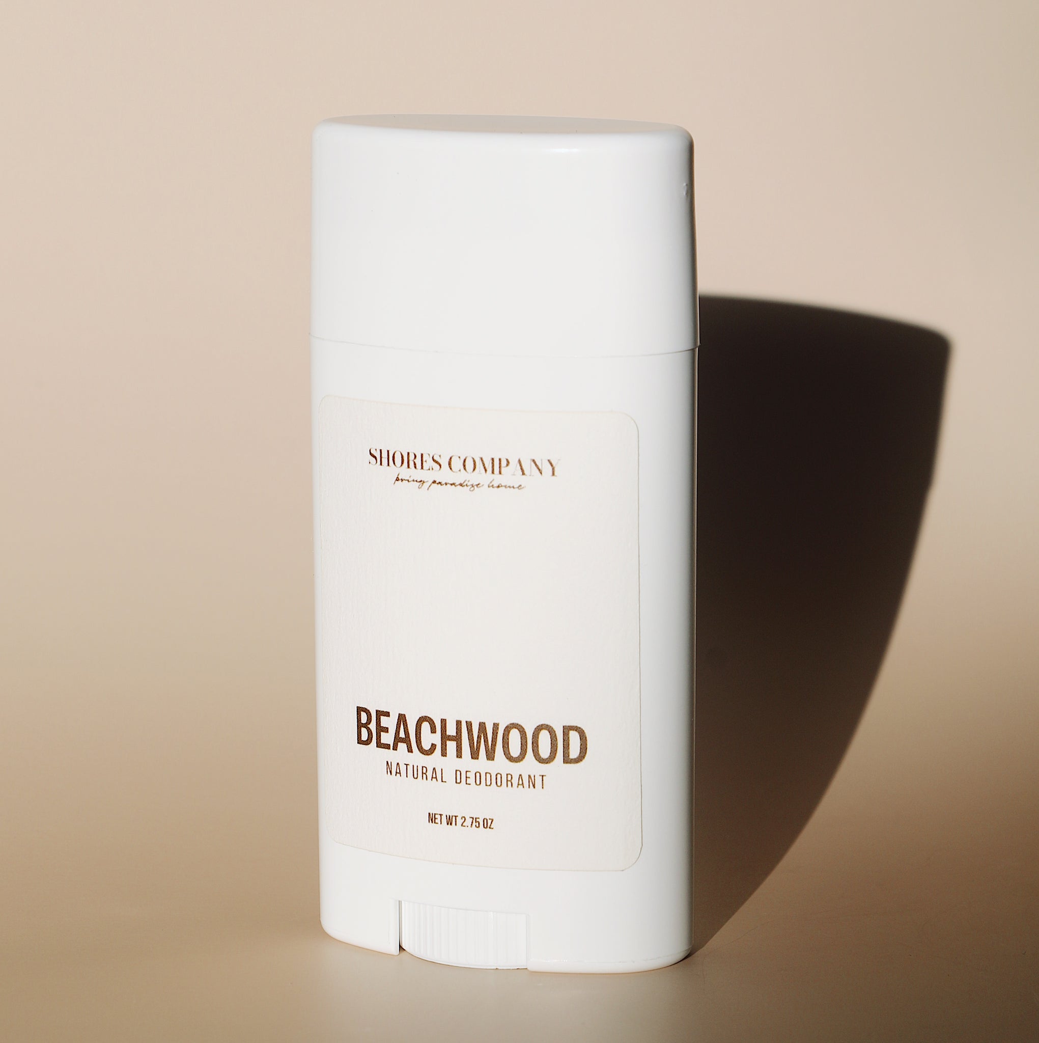 A sleek, neutral-toned close-up of Beachwood Natural Deodorant, capturing its refined aesthetic and sustainable design.