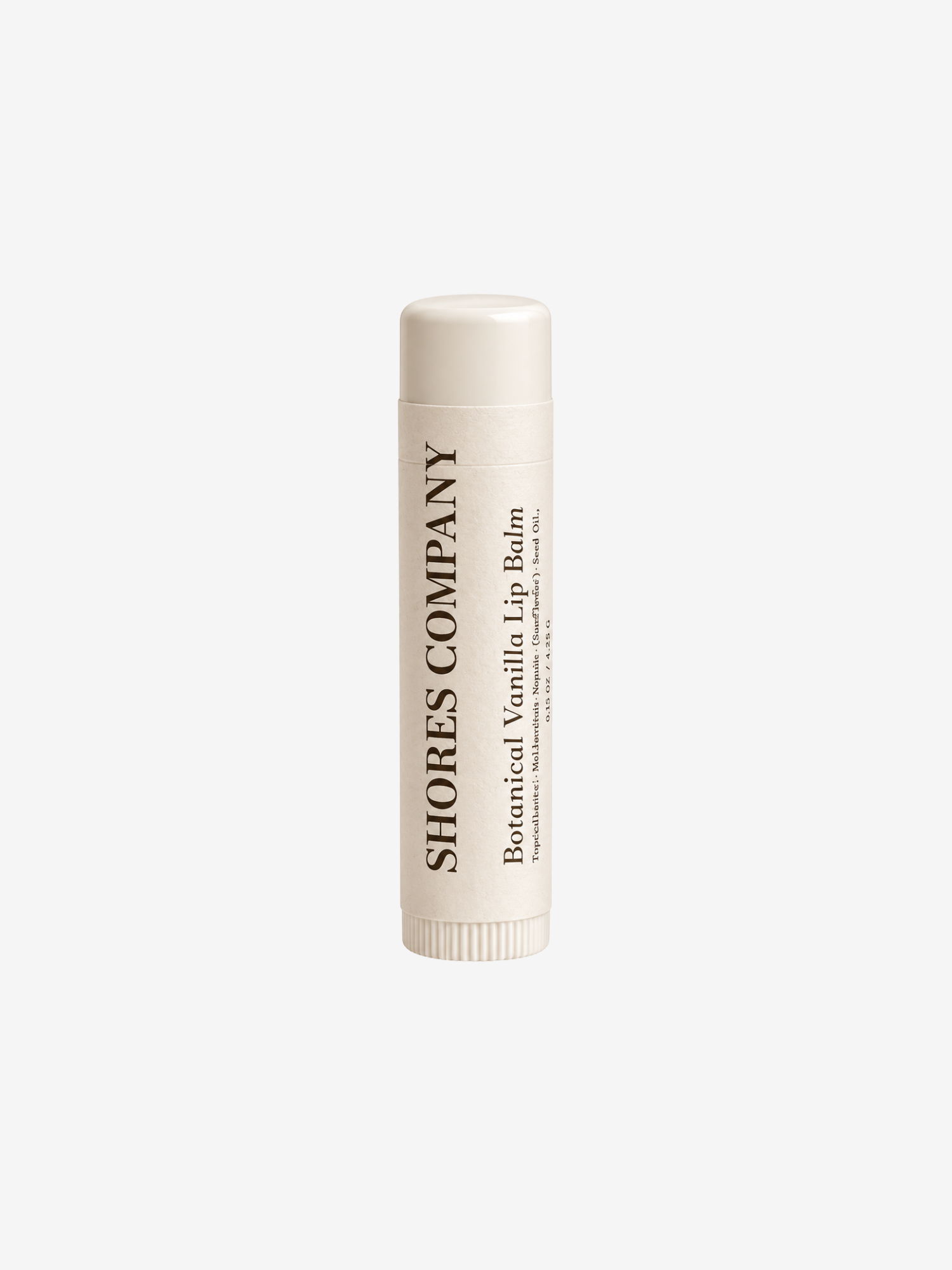 A single tube of Shores Company Botanical Vanilla Lip Balm, shown upright against a solid off-white background.