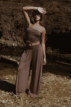 Brisa Lounge Pant in coco husk bamboo fabric, beach setting