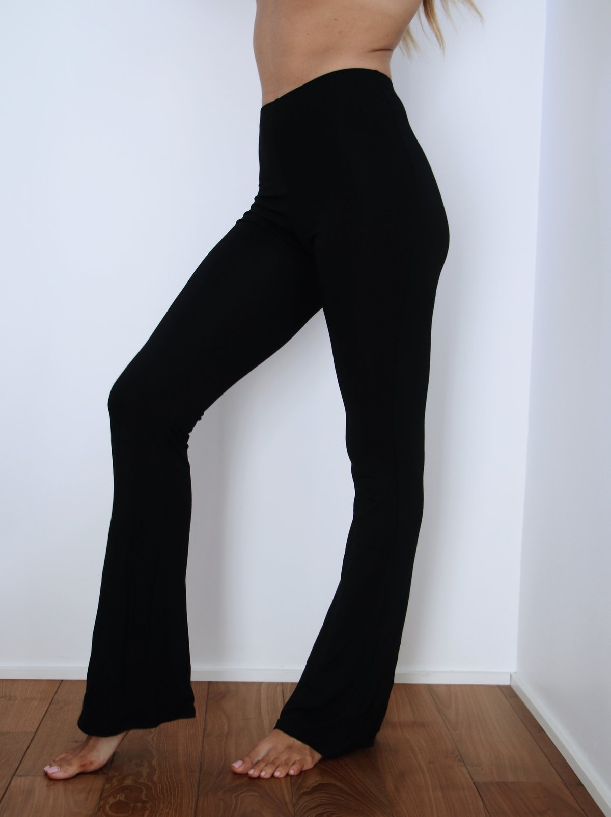 Side view of Indah Lounge Pant – high-waisted, relaxed fit with a flowy silhouette.