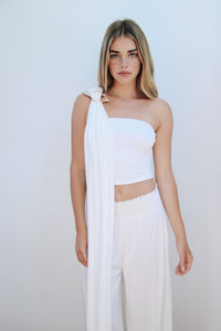 Model wearing Kirra Set in White – bandeau top styled with a wrap closure.