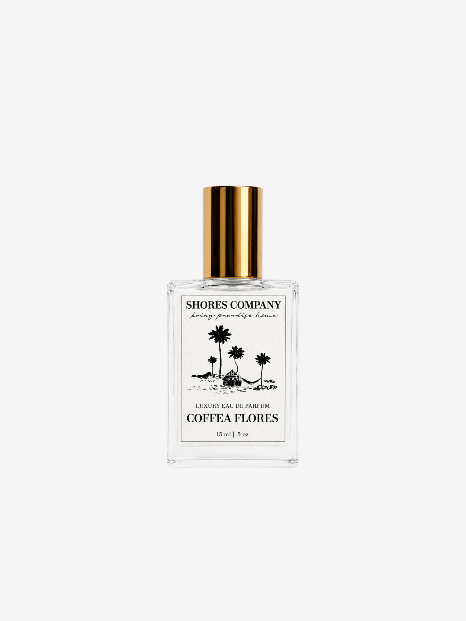 Shores Company Coeffe Flores perfume bottle with a gold cap and white label, centered on a light gray background.