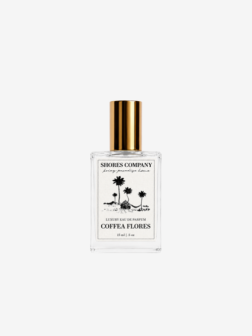 Shores Company Coeffe Flores perfume bottle with a gold cap and white label, centered on a light gray background.