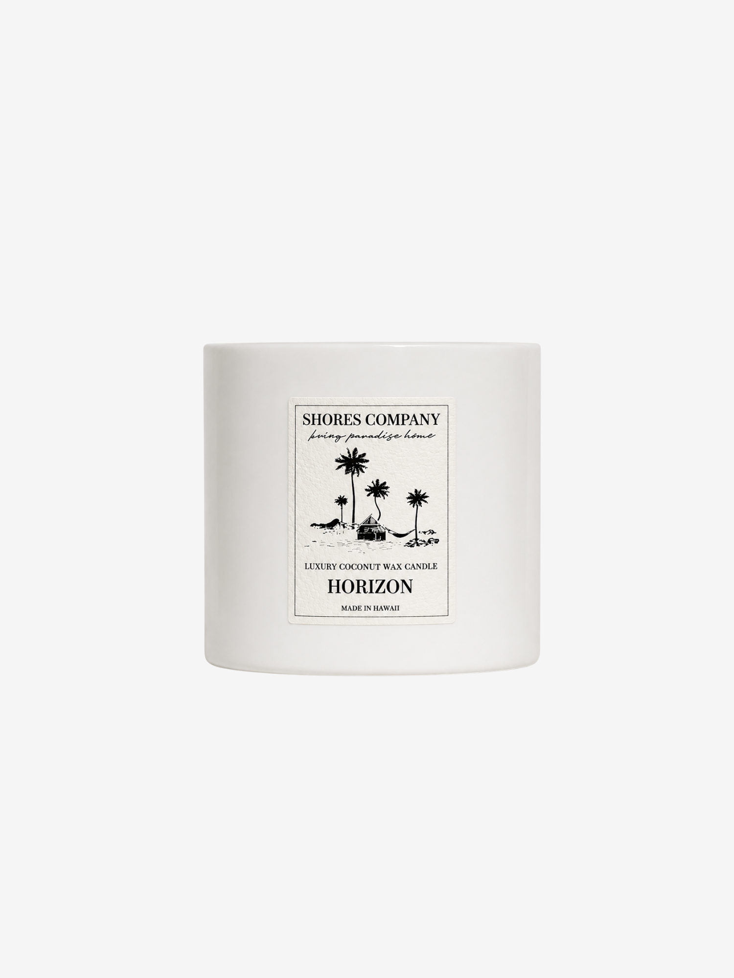 A white ceramic jar candle with a minimalist gold and white label from Shores Company, featuring a palm tree illustration and the scent name Horizon, set against a solid white background.