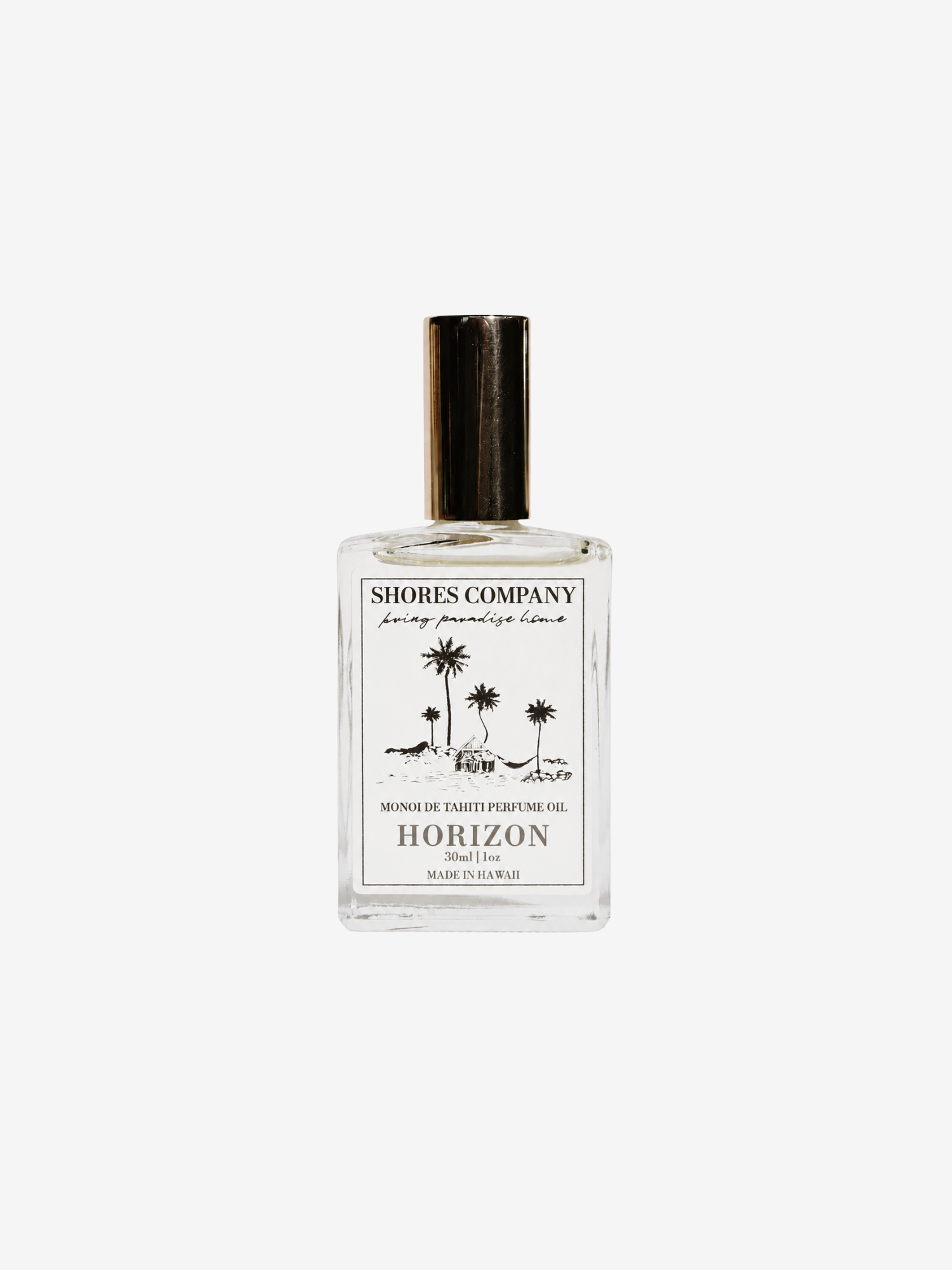 A clear glass bottle of Shores Company Horizon coconut body oil with a gold cap and a white label featuring a palm tree illustration, set against a solid light gray background.