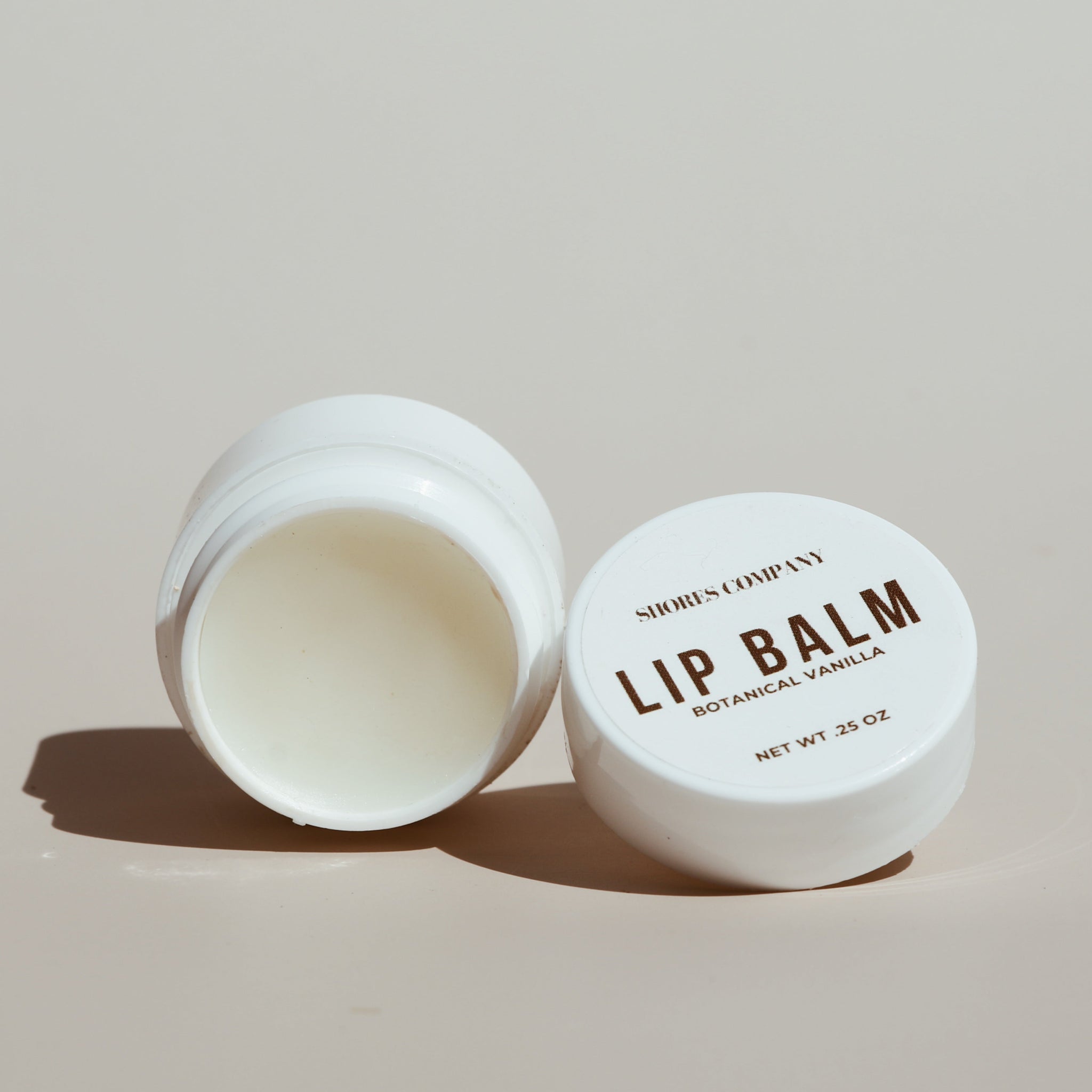 Close-up of Shores Company Lip Nectar Balm, a deeply hydrating formula infused with botanical oils.