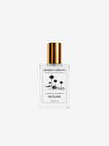 oceano eau de parfum mini roller with gold cap and luxury white label on white background