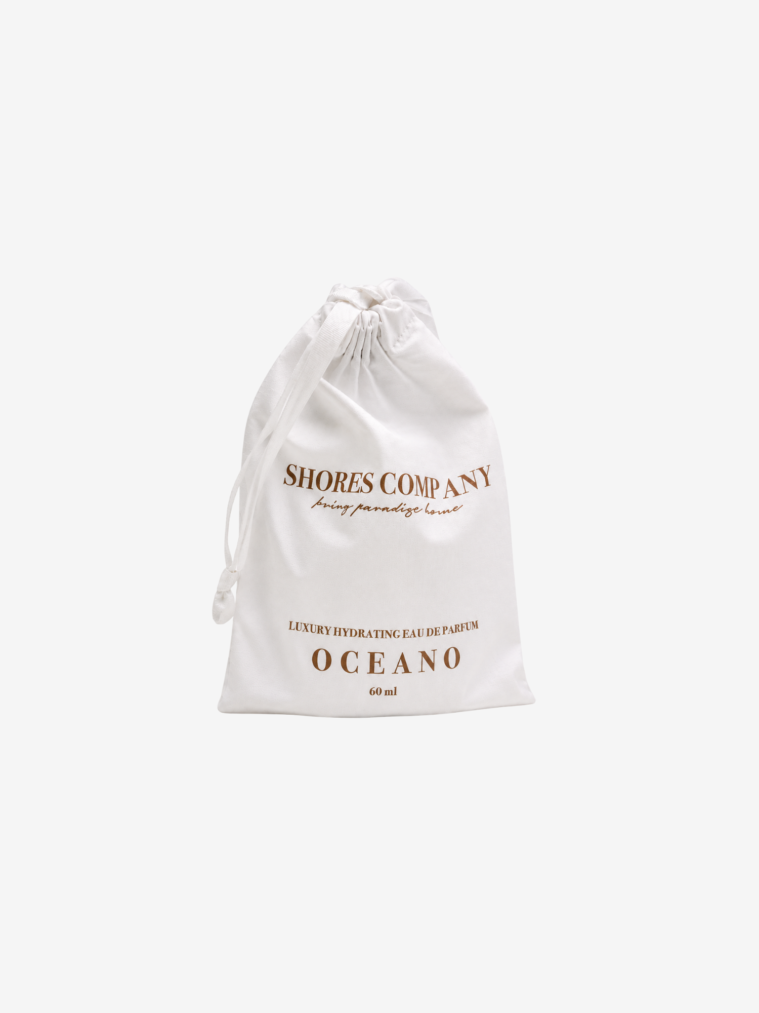 An off-white drawstring pouch with gold lettering reading 'SHORES COMPANY' and 'OCEANO' on a plain light gray background.