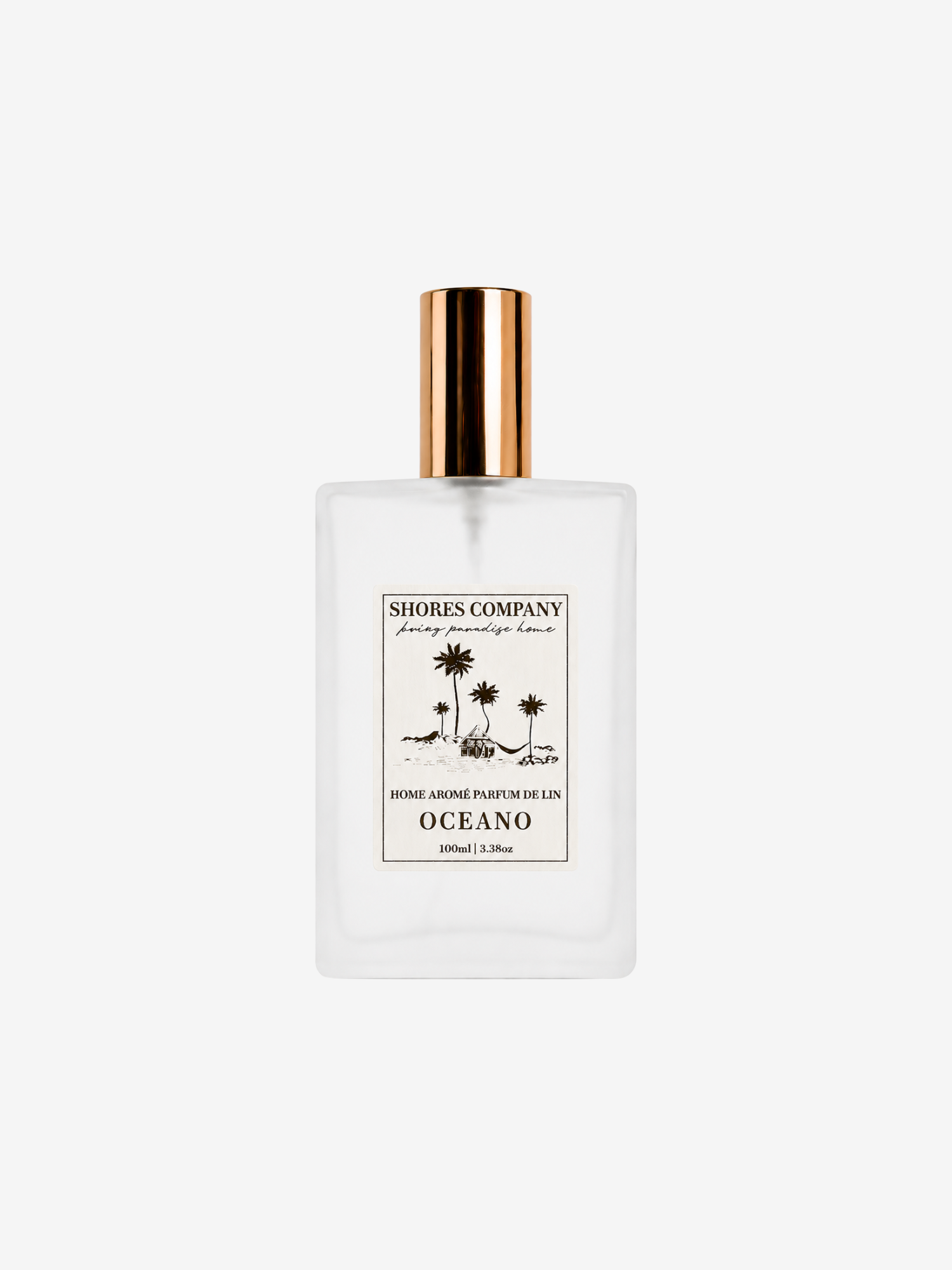 A clear rectangular glass perfume bottle with a gold cap, featuring a white label with gold text and palm tree illustrations. The brand 'Shores Company' is clearly visible on the label.