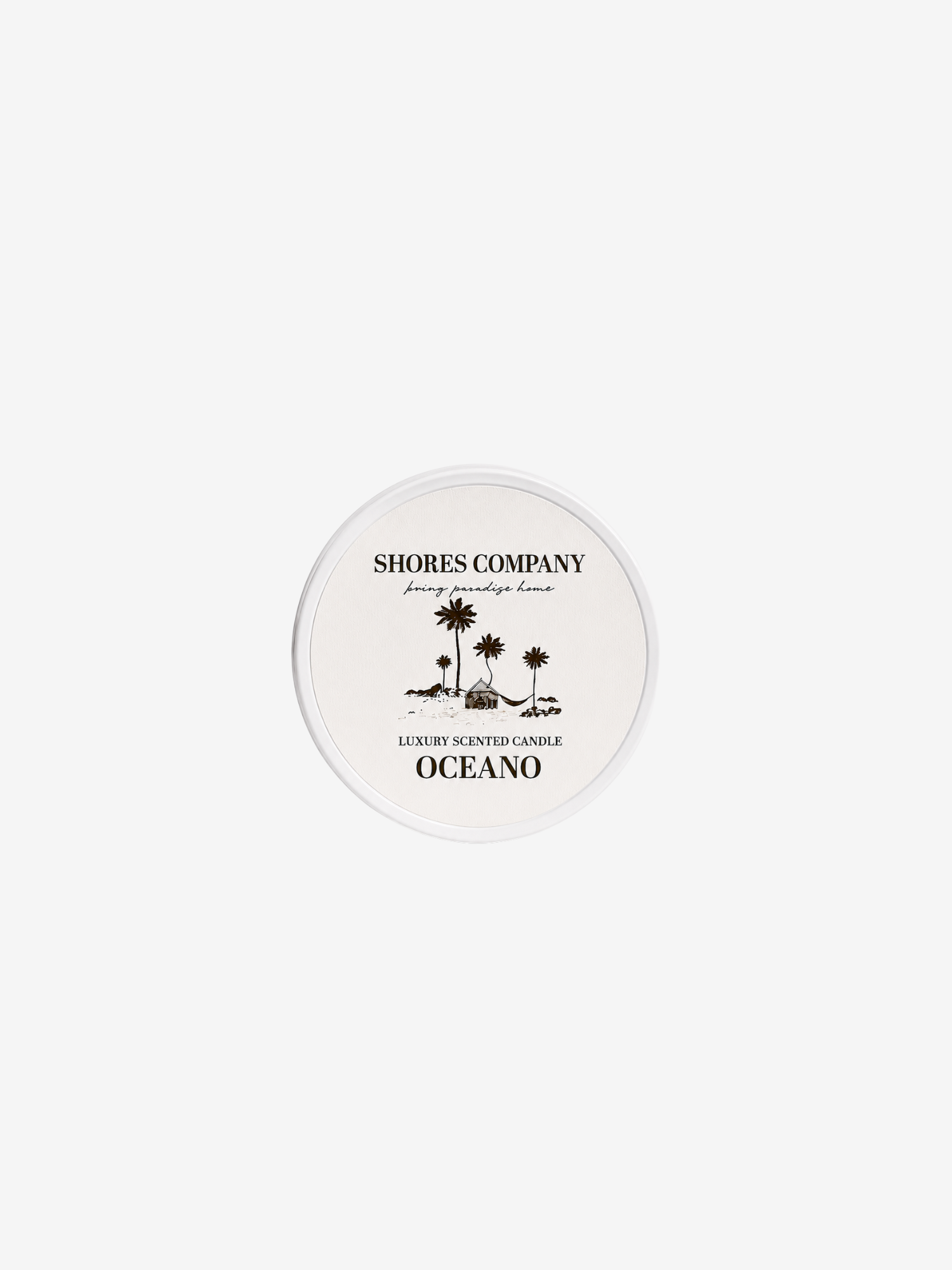 A round white tin of Shores Company Oceano luxury scented candle, featuring a gold palm tree graphic and text, centered on a light gray background.