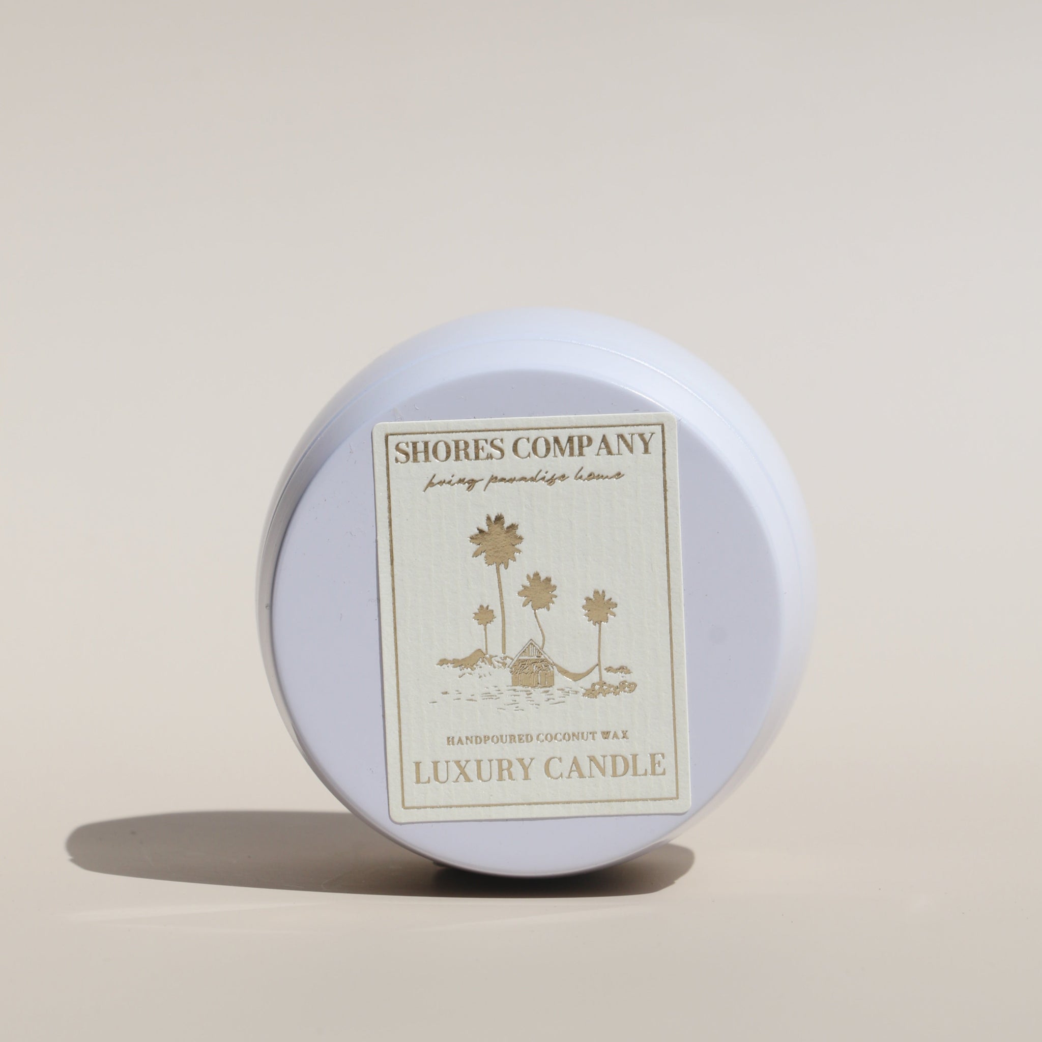 Shores Company 4oz travel candle in a sleek white tin, perfect for on-the-go luxury scenting.