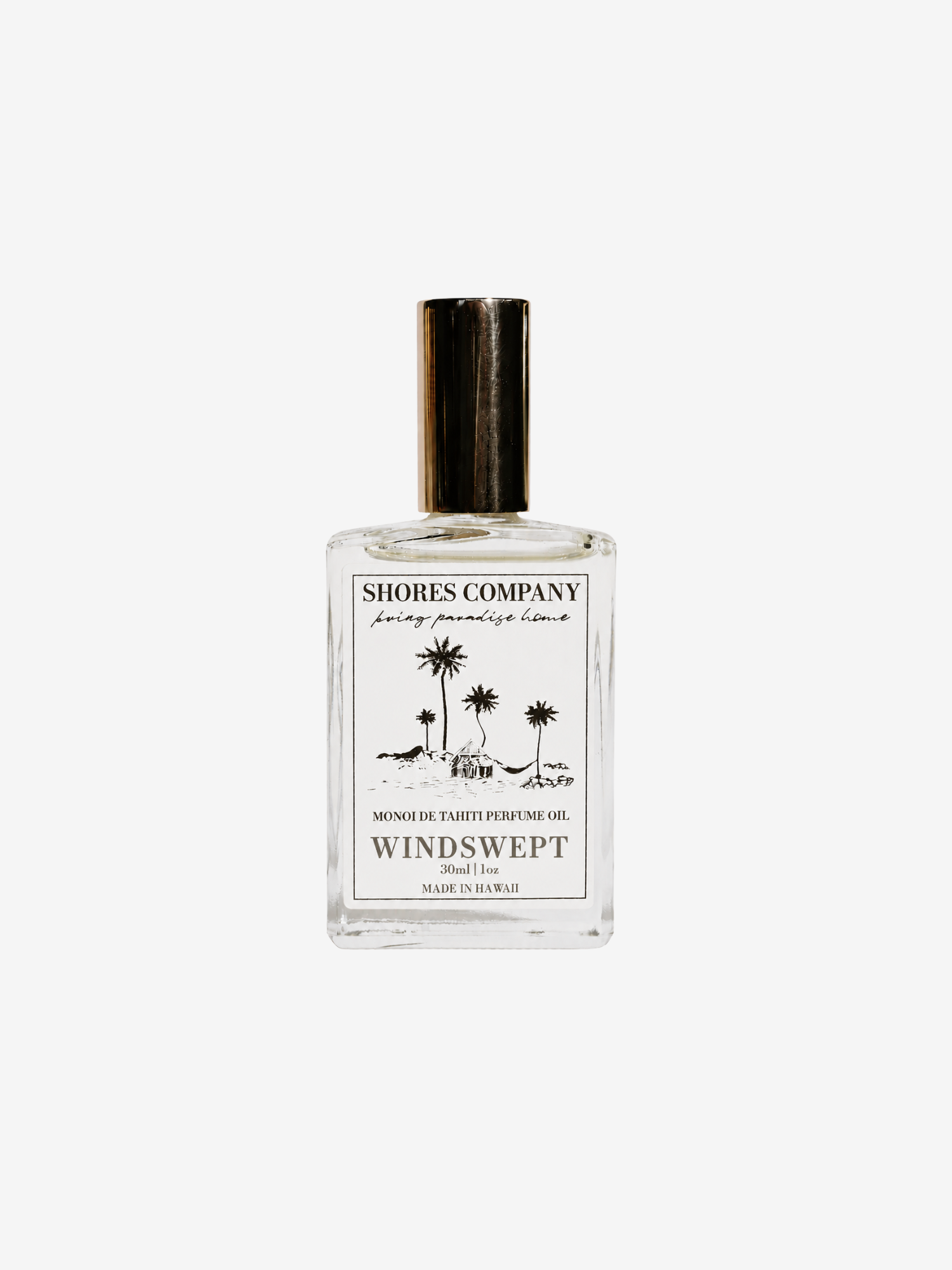 Shores Company Windswept Monochromatic perfume oil in a clear glass bottle with a black cap and a white label featuring black text and palm tree illustrations, set against a light gray background.