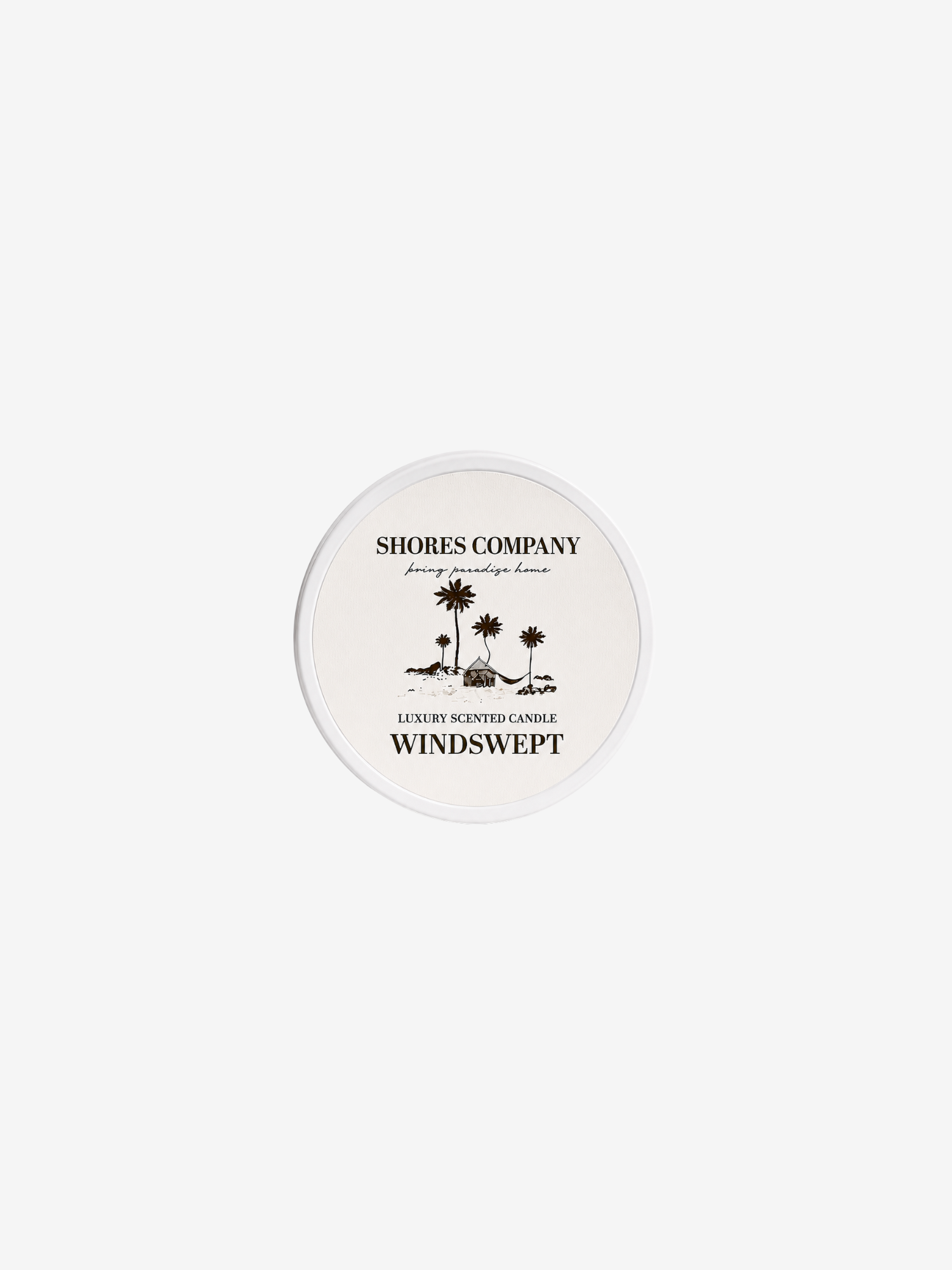 A round white candle tin with a black printed graphic of palm trees and the text 'SHORES COMPANY' and 'WINDSWEPT' on a light gray background.