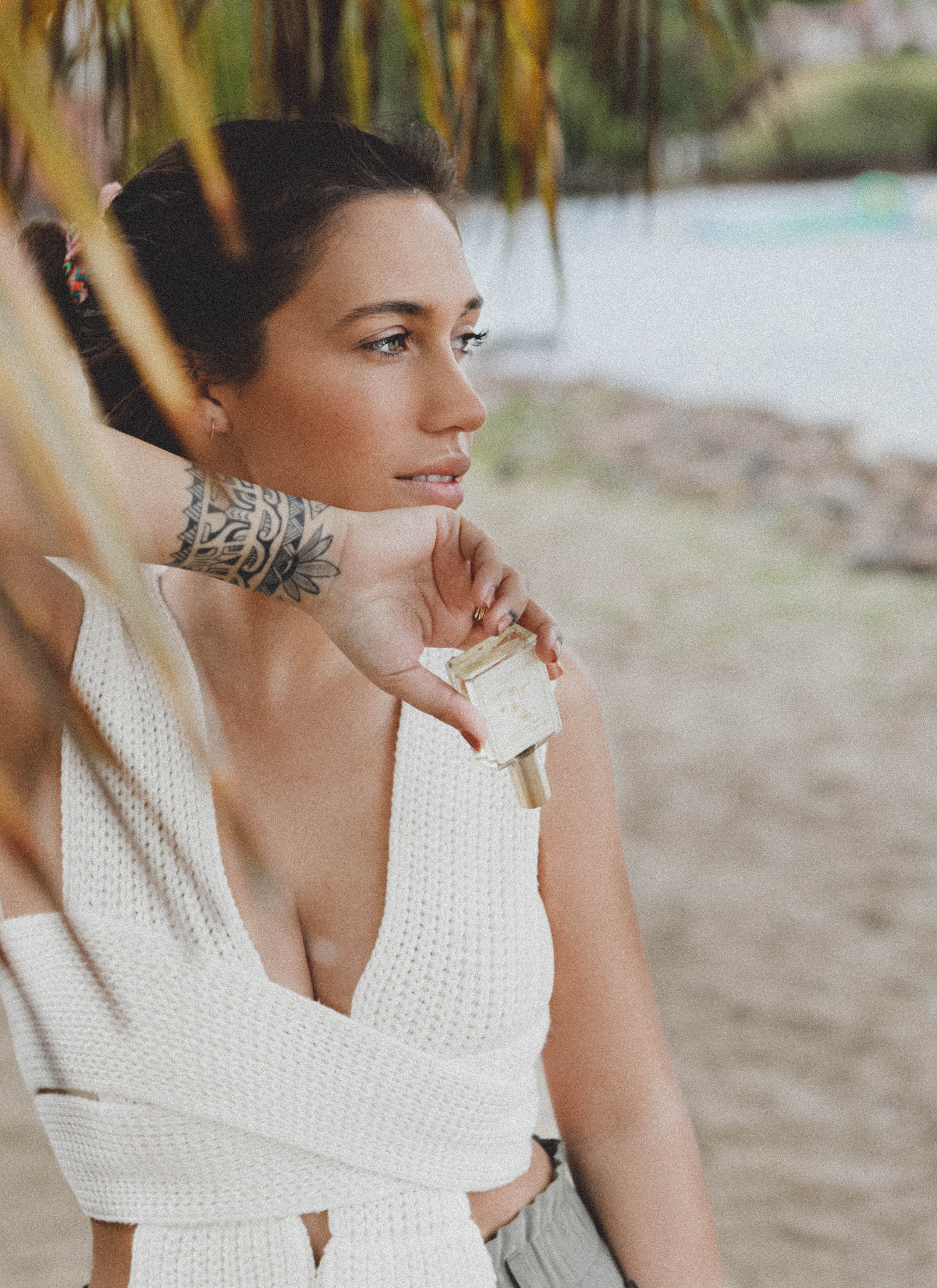 on the beach with Shores Company monoi oil perfume